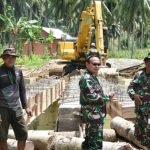 Kodim 1314/Gorut, Kerahkan Alat berat Percepat Pembangunan Jembatan