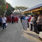 Kanit Binmas Polsek Jawilan Polres Serang Hadiri Lomba Gerak Jalan HUT RI 78 di Halaman Kantor Kecamatan